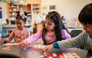 Transition to Kindergarten classroom at Washington Elementary. Students playing bingo.